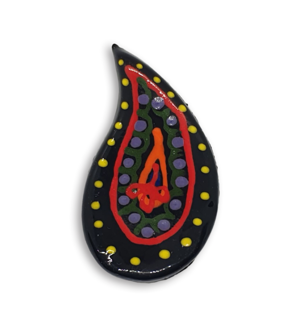 A hand-painted black teardrop boteh boho motif ceramic mosaic insert with red, yellow, green and purple detailing.