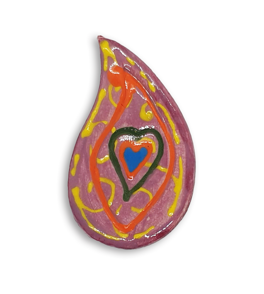 A hand-painted pink teardrop boteh boho motif ceramic mosaic insert with a blue heart design and orange detailing.