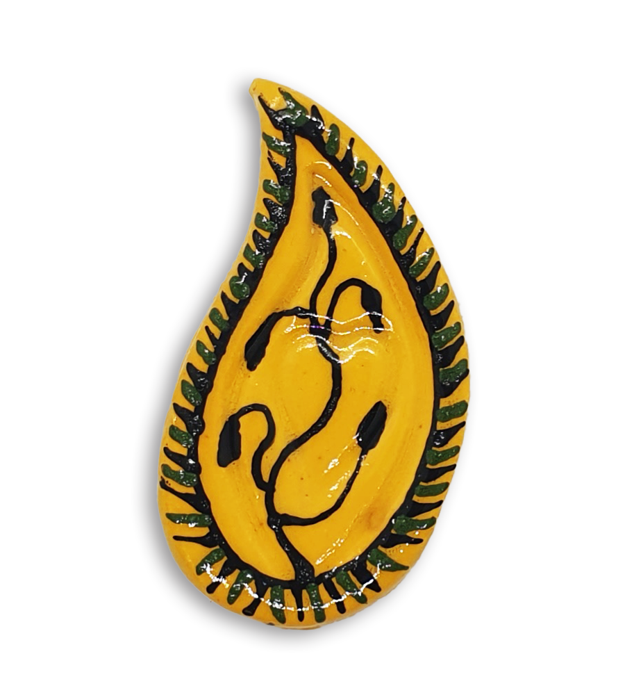 A hand-painted yellow teardrop boteh boho motif ceramic mosaic insert with a black vine or plant design.