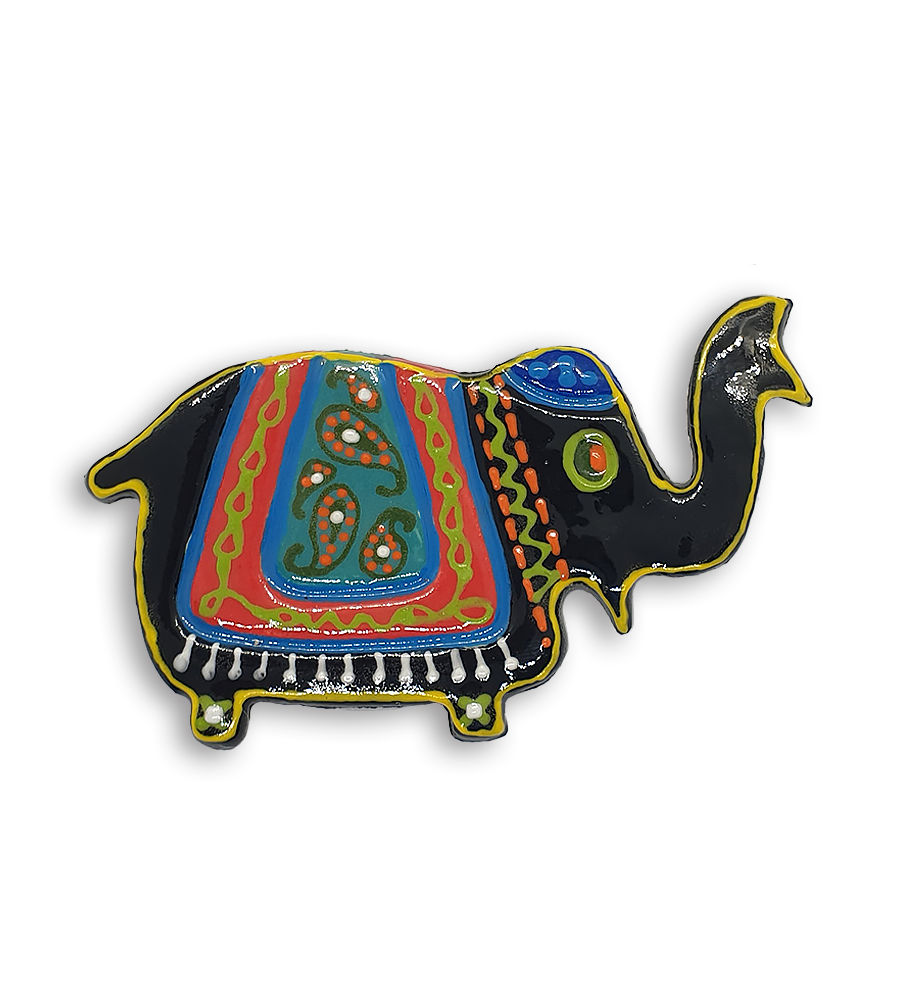 A black hand-painted Indian elephant ceramic mosaic insert with a yellow rim and green eyes.