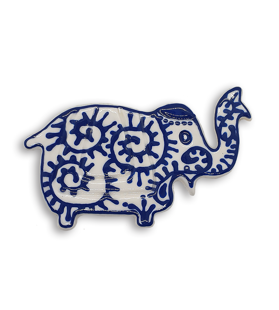 A white Indian elephant ceramic mosaic insert with hand-painted blue spiral designs.