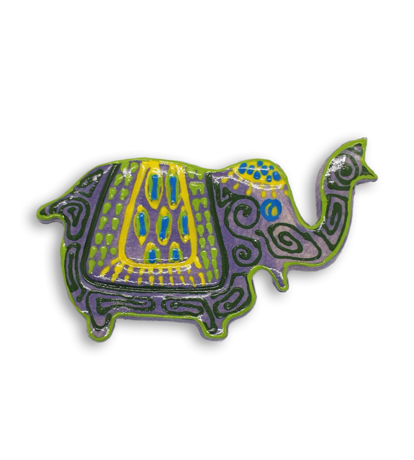 A purple Indian elephant ceramic mosaic insert with hand-painted green and yellow designs.