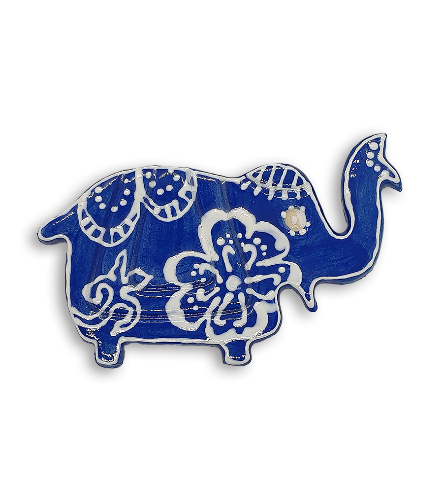 A blue Indian elephant ceramic mosaic insert with hand-painted white floral designs.