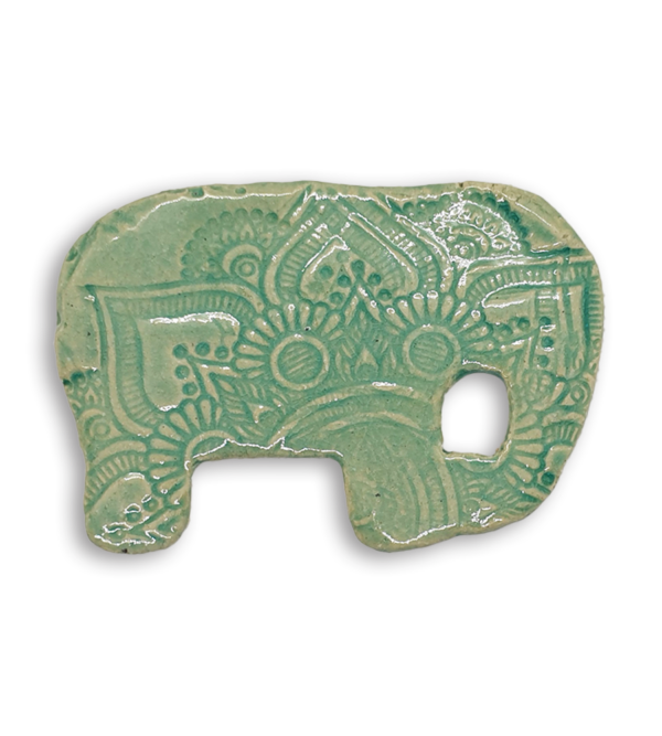 A mint green embossed and textured elephant ceramic mosaic insert.