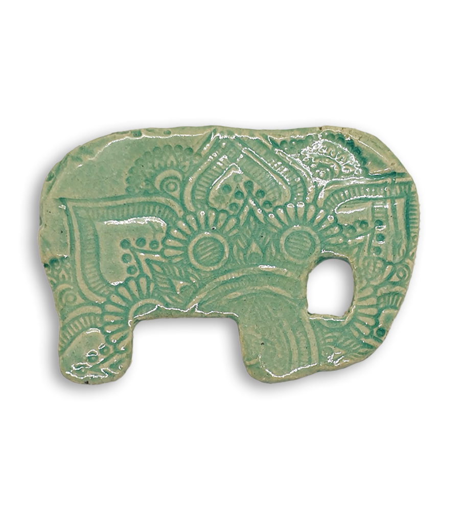 A mint green embossed and textured elephant ceramic mosaic insert.