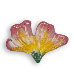 A hand-painted and textured flower petal ceramic mosaic insert with green, yellow, pink and cream colours.