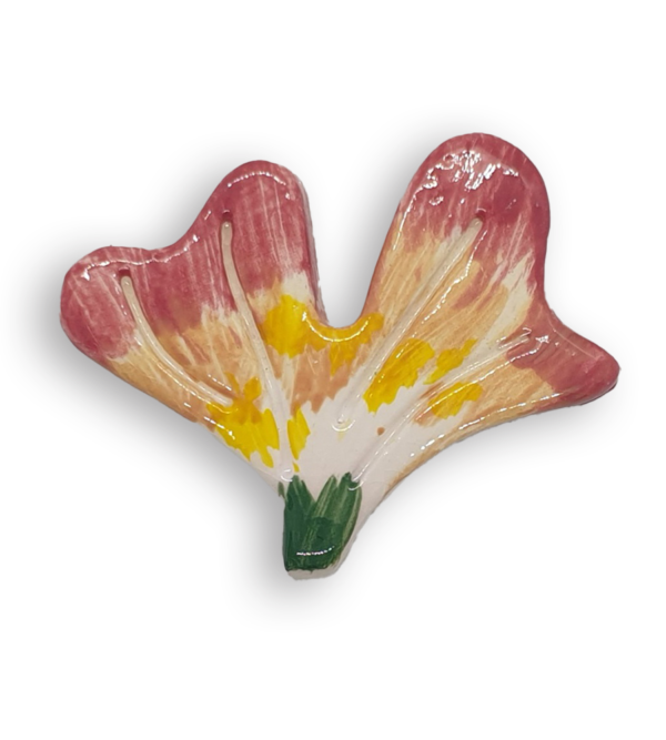 A hand-painted flower petal ceramic mosaic insert with green, yellow, pink and cream colours.