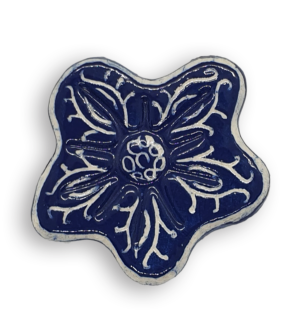 A hand-painted navy blue anemone ceramic mosaic insert with white swirling designs.