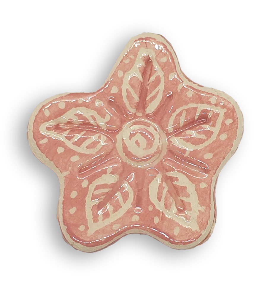 A hand-painted light pink anemone ceramic mosaic insert with white leaf-shaped designs.