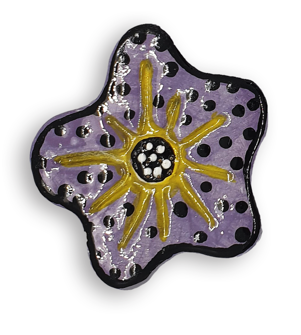 A hand-painted purple anemone ceramic mosaic insert with black spots and a yellow starburst design.