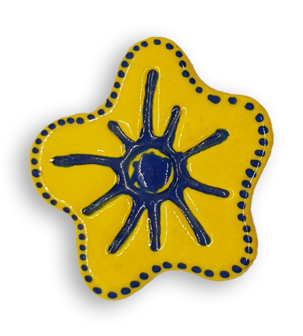 A hand-painted sunshine yellow anemone ceramic mosaic insert with a rim of blue dots.