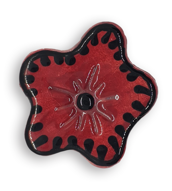 A hand-painted dark red anemone ceramic mosaic insert with black details.