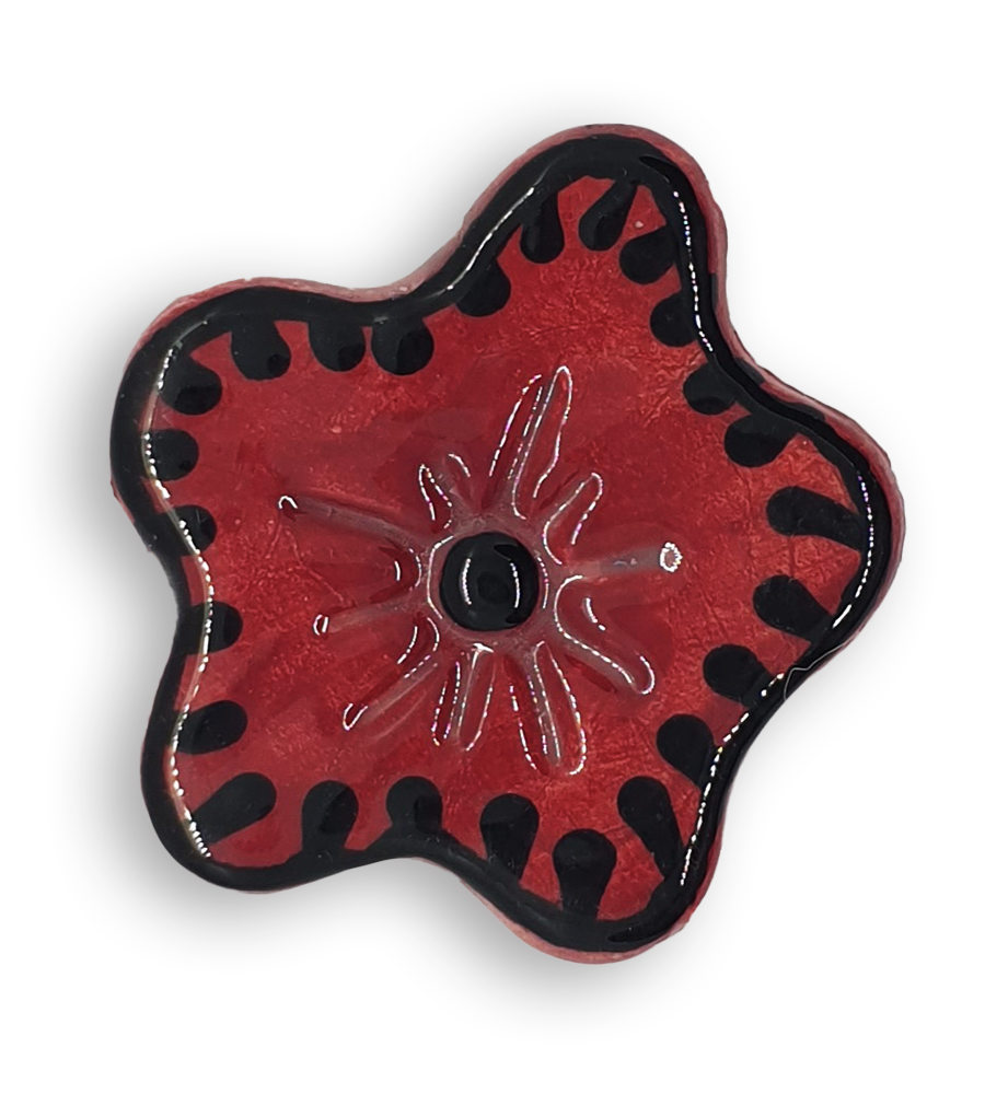 A hand-painted dark red anemone ceramic mosaic insert with black details.