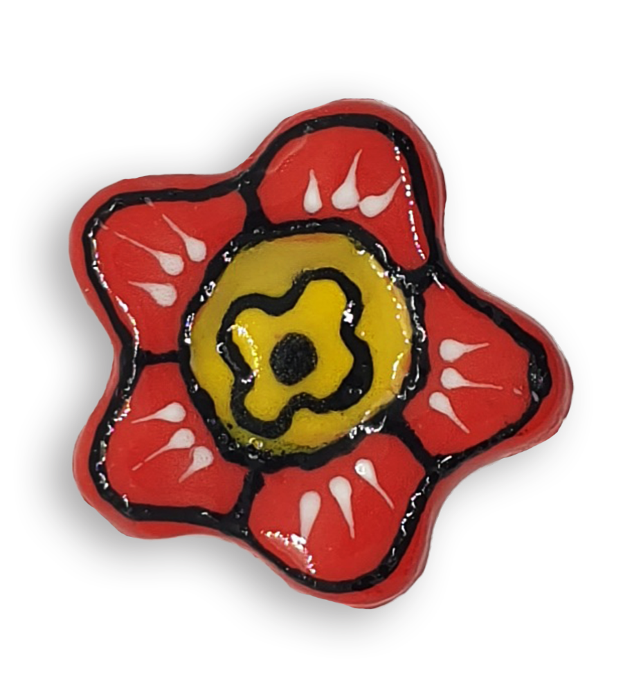 A hand-painted bright red anemone ceramic mosaic insert with black and white details and a yellow centre.