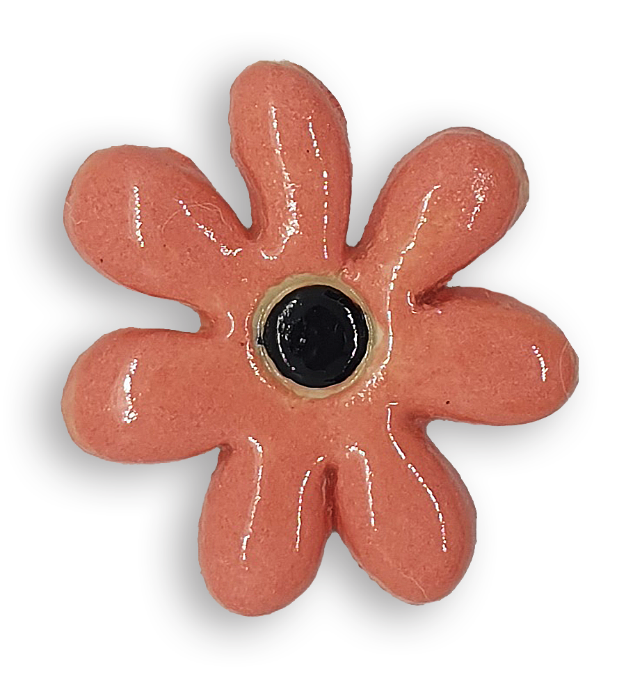 A peachy pink daisy flower ceramic mosaic insert with a black centre.