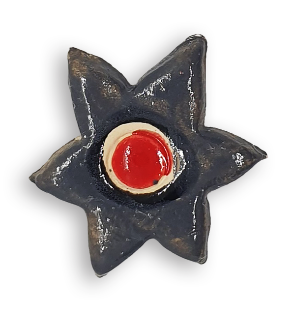 A grey star-shaped flower ceramic mosaic insert with hand-painted red details.