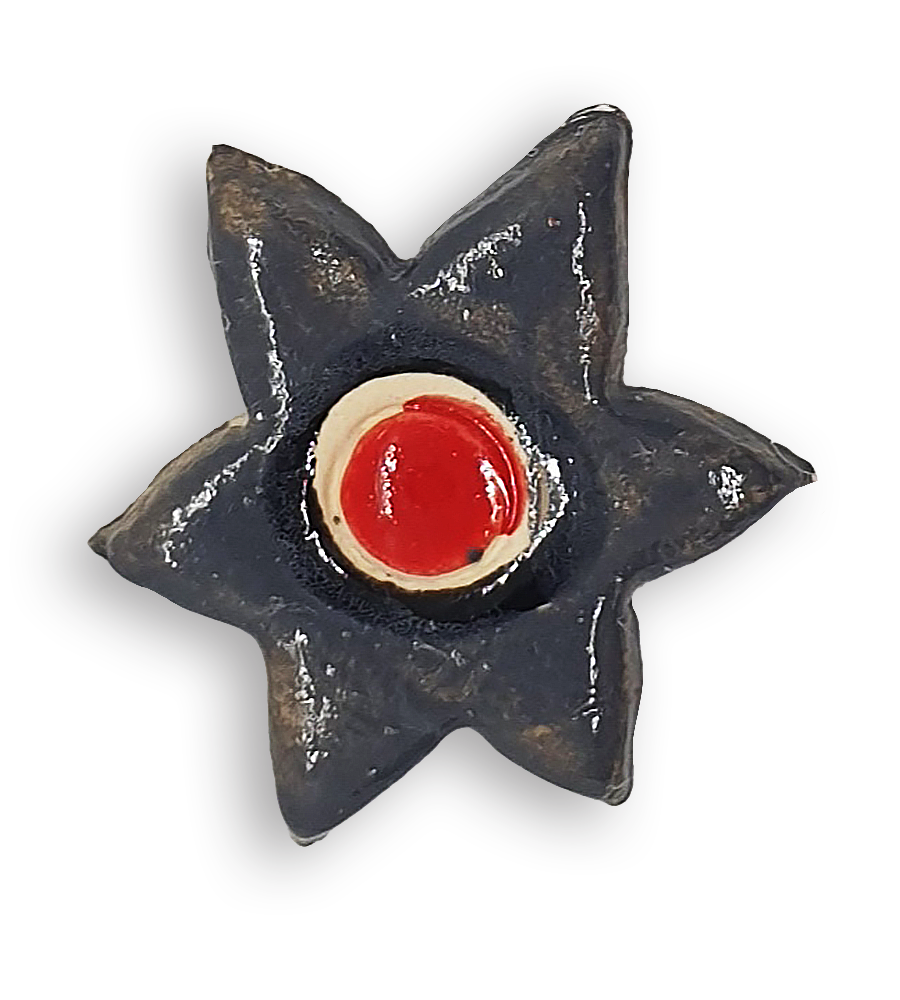 A grey star-shaped flower ceramic mosaic insert with hand-painted red details.