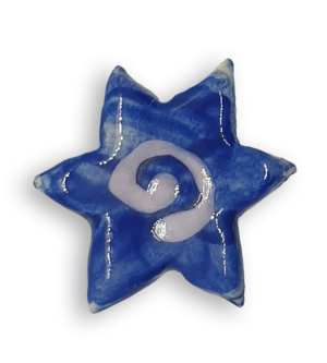 A blue star-shaped ceramic mosaic insert with a white spiral at its centre.