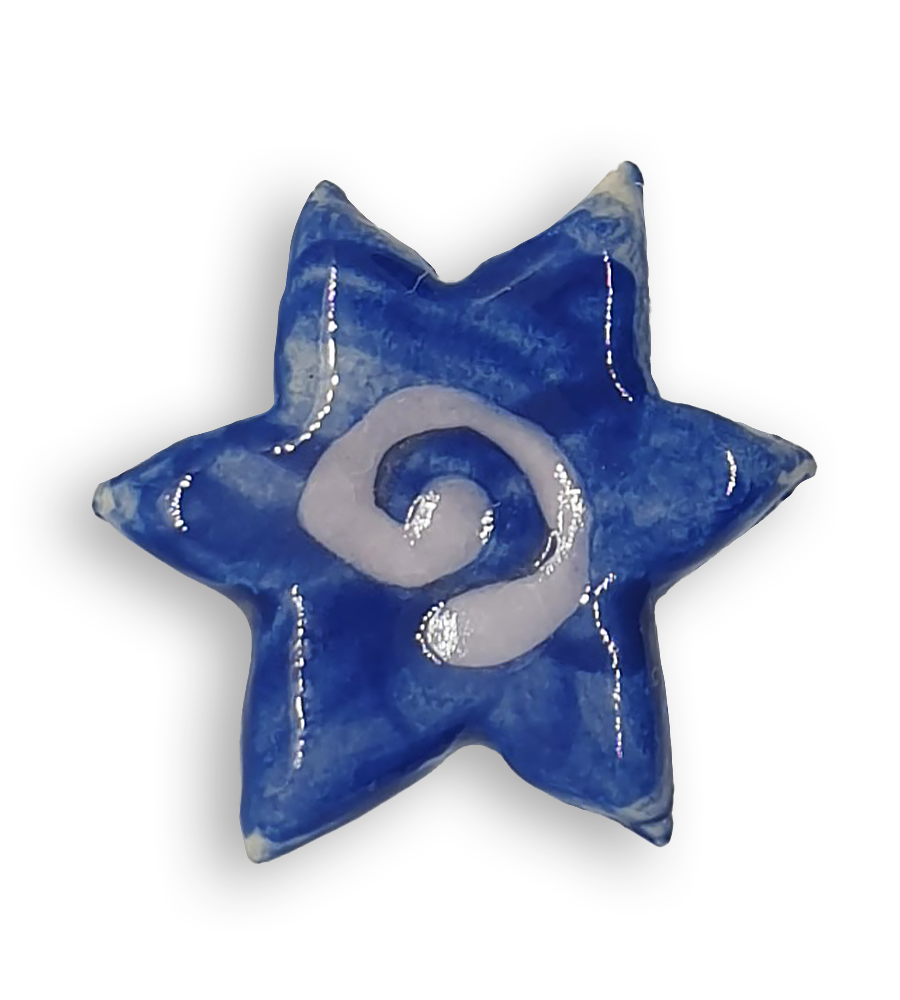 A blue star-shaped ceramic mosaic insert with a white spiral at its centre.