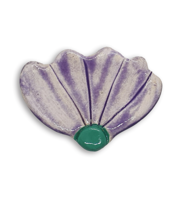 A light purple hand-painted ceramic mosaic insert shaped like a flower.