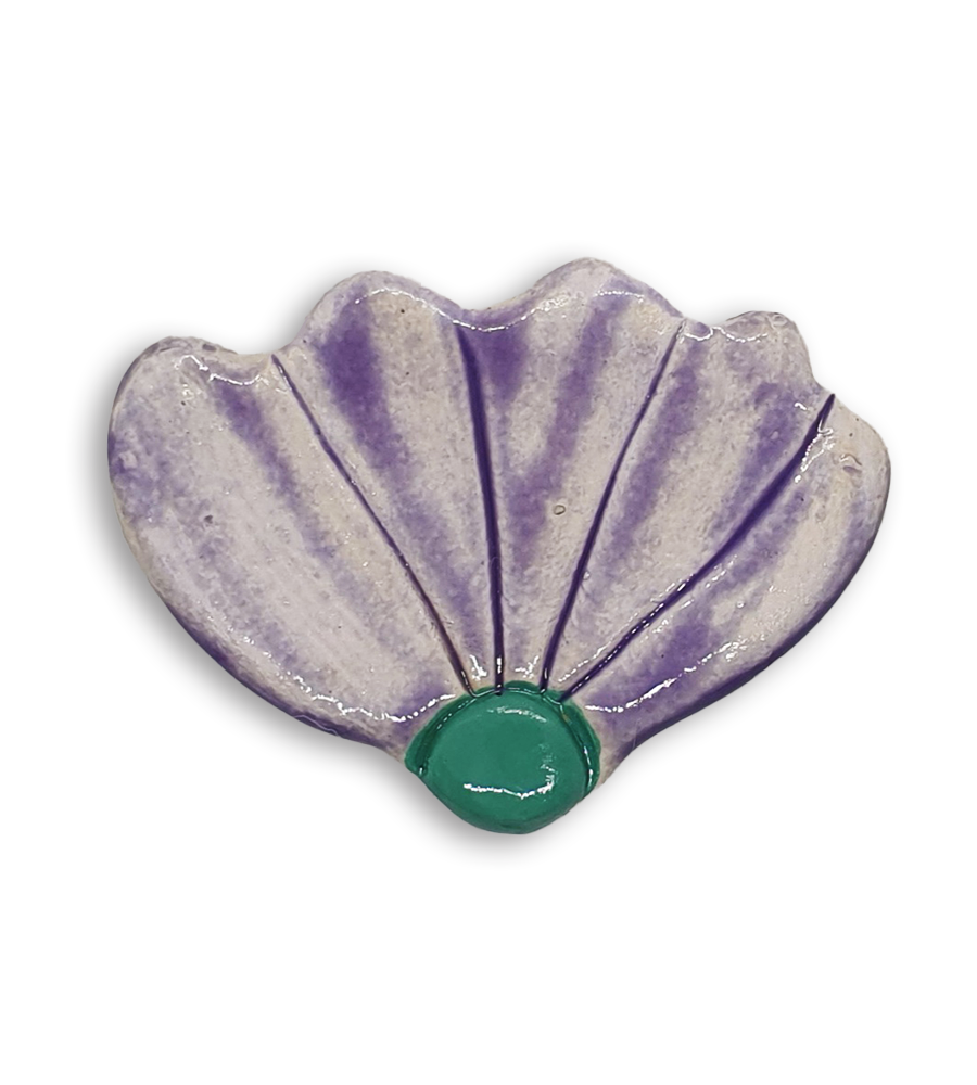 A light purple hand-painted ceramic mosaic insert shaped like a flower.