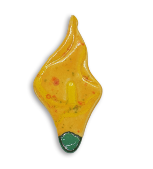 A yellow arum flower or calla lily ceramic mosaic insert with a green and orange speckled design.