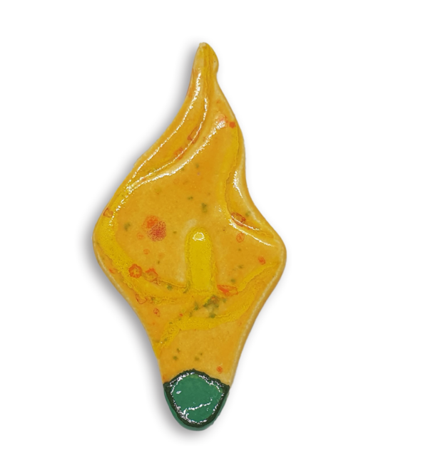 A yellow arum flower or calla lily ceramic mosaic insert with a green and orange speckled design.