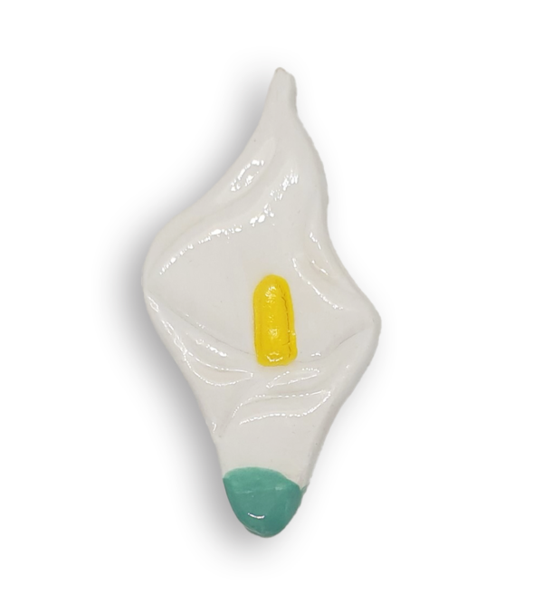 A white arum flower or calla lily ceramic mosaic insert with a green base.