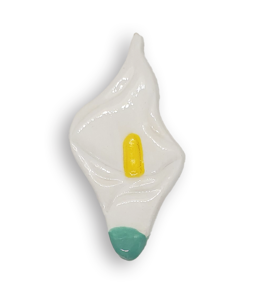 A white arum flower or calla lily ceramic mosaic insert with a green base.