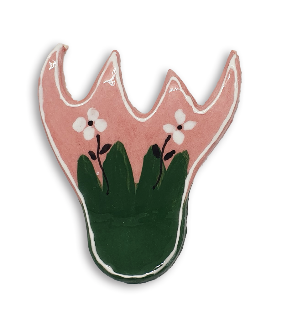 A pink and green bellflower ceramic mosaic insert with small white flowers.