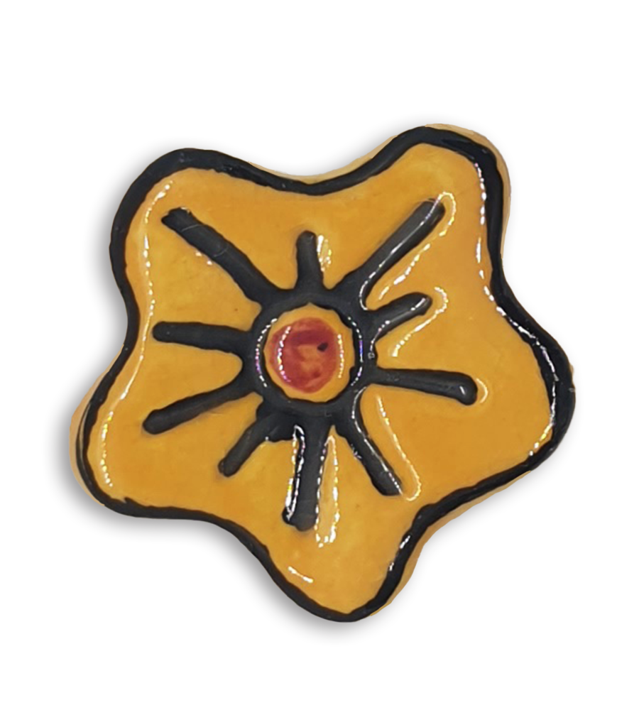 A hand-painted dark yellow anemone ceramic mosaic insert with black and red details.