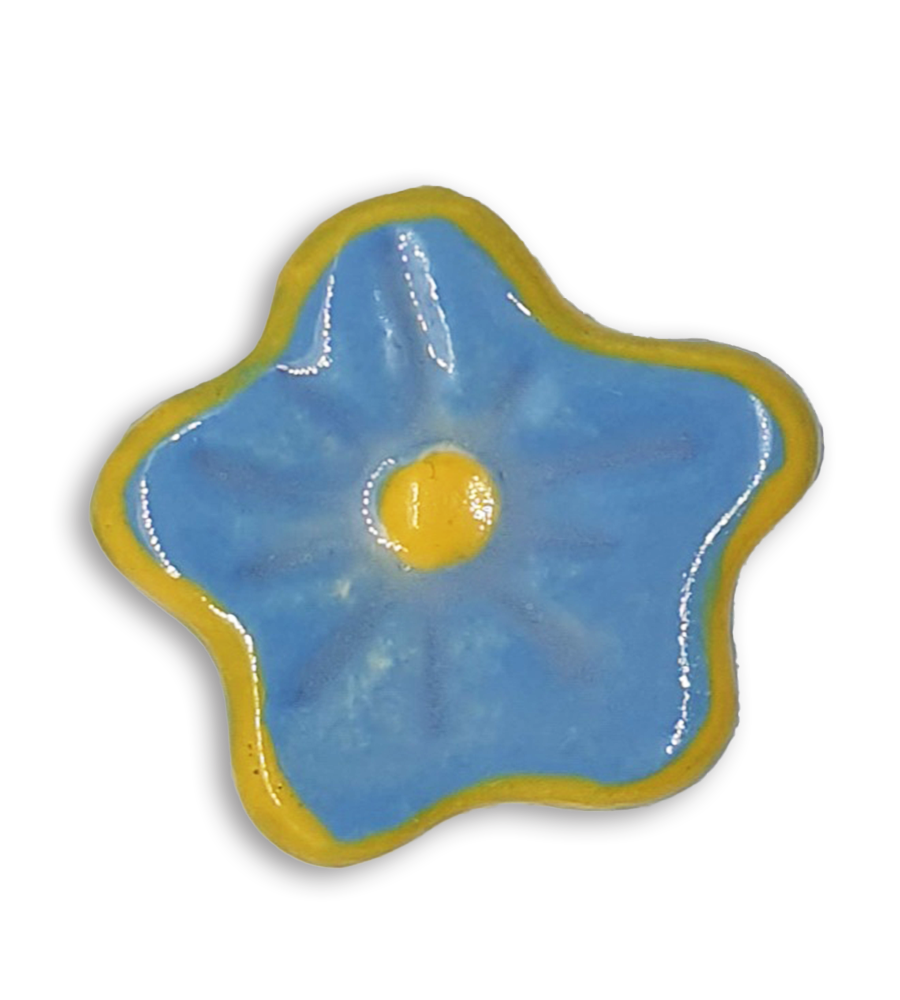 A hand-painted powder blue anemone ceramic mosaic insert with a yellow rim.