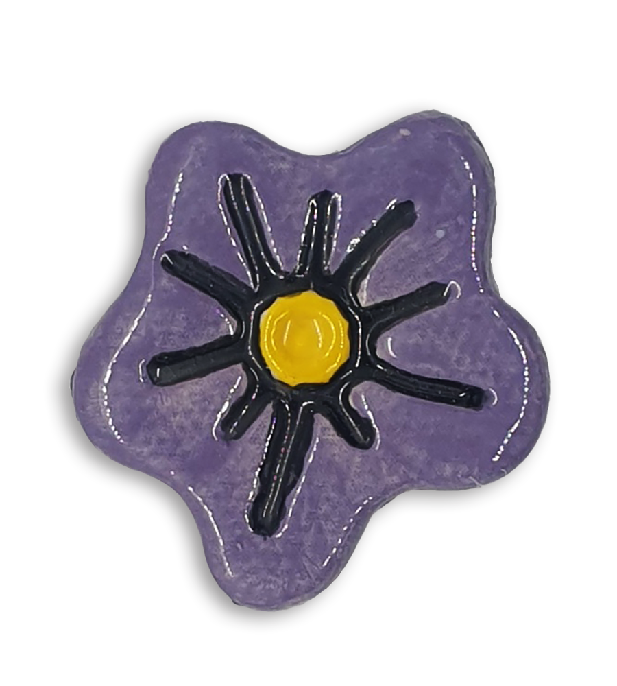 A purple hand-painted anemone ceramic mosaic insert with a yellow centre.