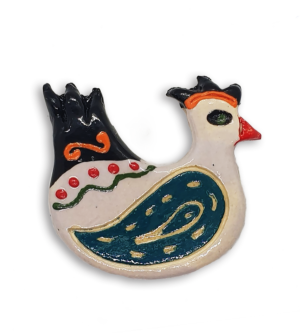 A hand-painted white hen ceramic mosaic insert with blue-green wings.