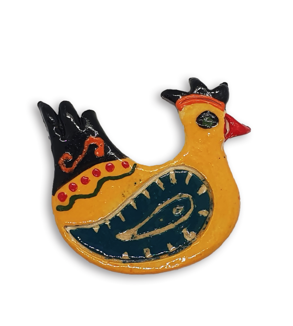 A hand-painted yellow hen ceramic mosaic insert with blue-green wings.