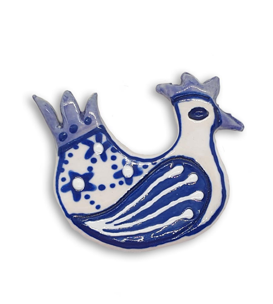 A hand-painted white and blue hen ceramic mosaic insert.