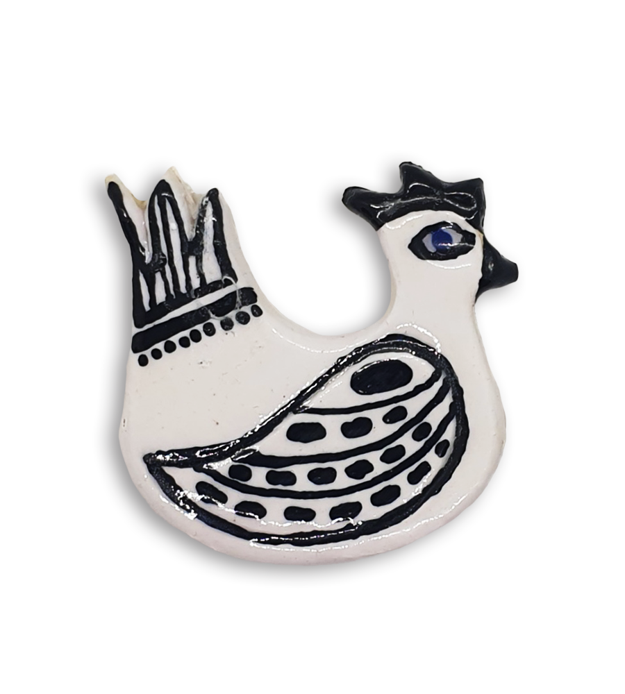 A hand-painted black and white hen ceramic mosaic insert.