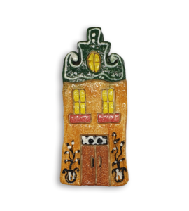 A hand-painted Dutch house ceramic mosaic insert with a green gabled roof.