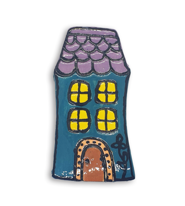 A hand-painted light blue English cottage house ceramic mosaic insert with purple roof shingles design.