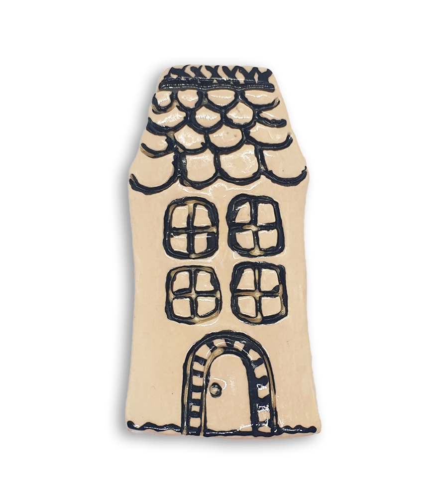 A hand-painted dark white English cottage house ceramic mosaic insert with roof shingles design.