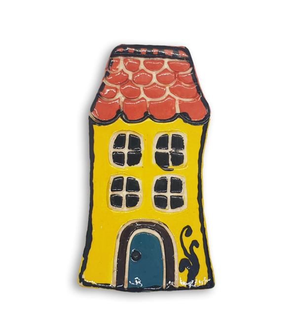 A hand-painted yellow English cottage house ceramic mosaic insert with red roof shingles design and a blue door.