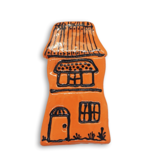 A hand-painted orange house ceramic mosaic insert with a detailed roof.