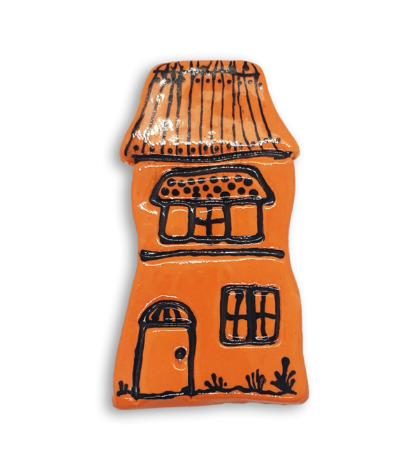 A hand-painted orange house ceramic mosaic insert with a detailed roof.