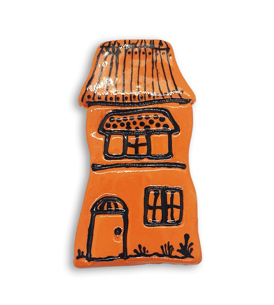 A hand-painted orange house ceramic mosaic insert with a detailed roof.