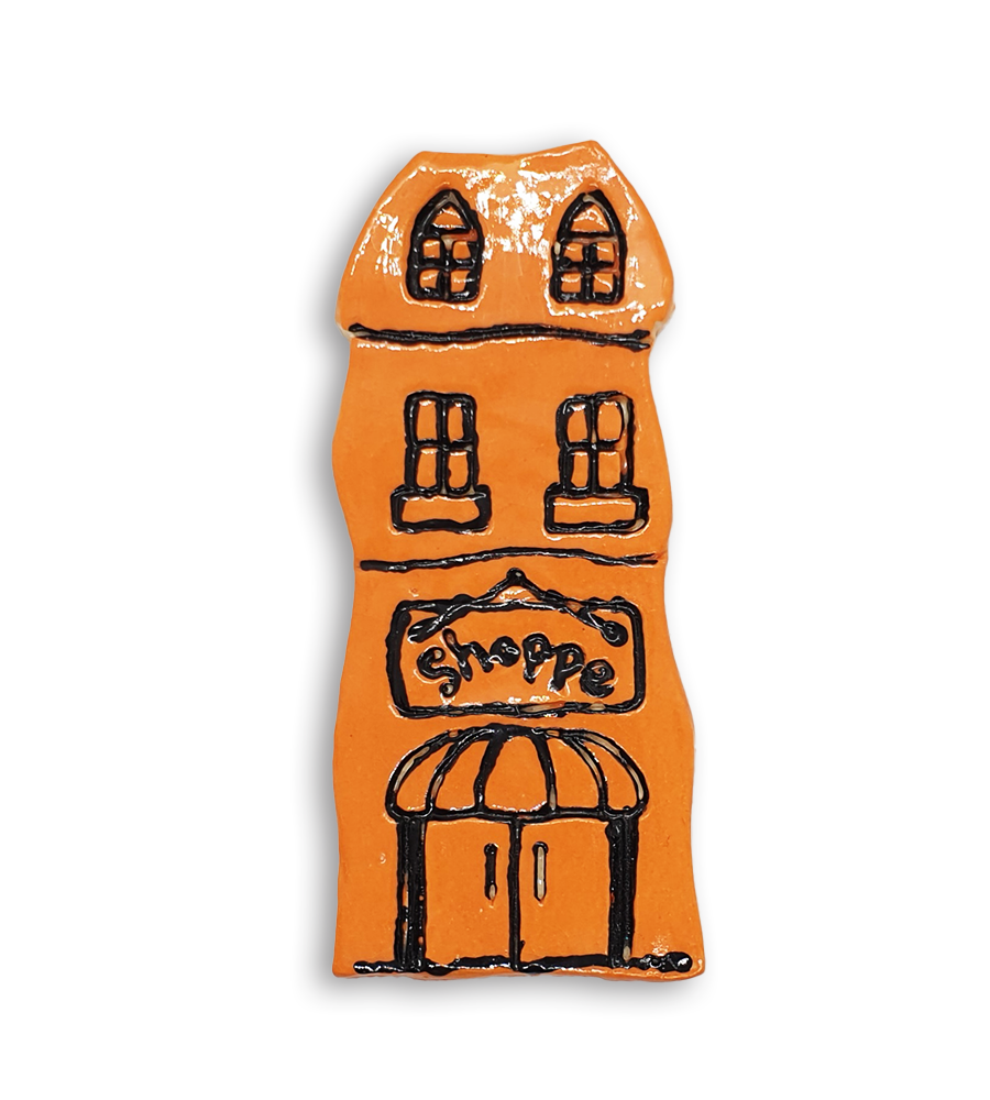 A hand-painted orange house ceramic mosaic insert with an old fashioned Shoppe sign.