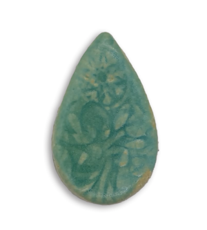 A pale greenish blue teardrop ceramic mosaic insert with a textured design.