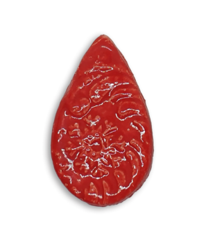 A red teardrop ceramic mosaic insert with a textured design.