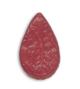 A dark pink teardrop ceramic mosaic insert with a textured design.