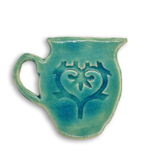 A hand-painted aqua jug ceramic mosaic insert with a swirling heart design.