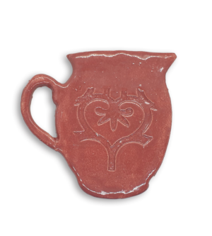 A hand-painted pink jug ceramic mosaic insert with a swirling heart design.